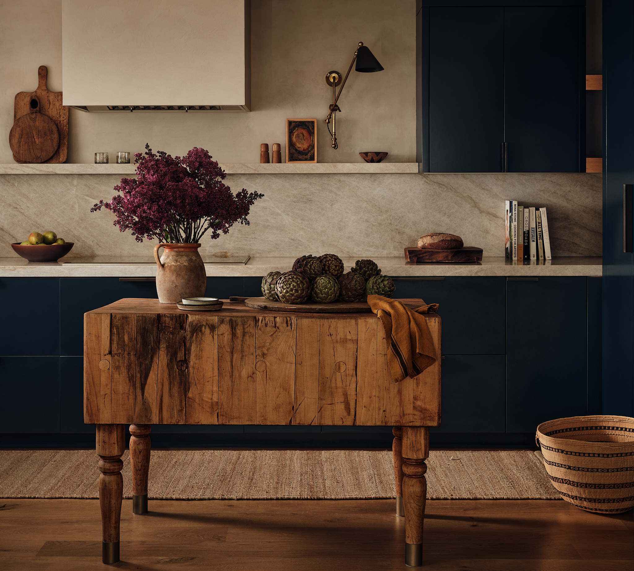A navy kitchen with a reclaimed butcher-block island
